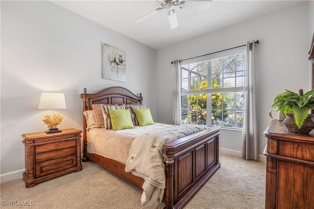 bedroom featuring light colored carpet and ceiling fan