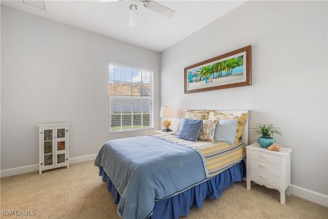 bedroom featuring light carpet and ceiling fan