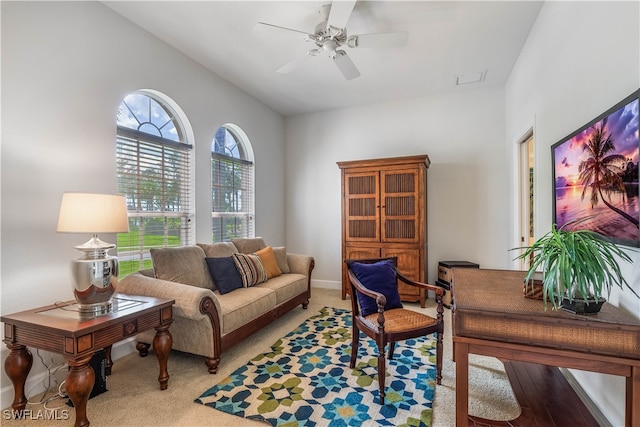 interior space featuring lofted ceiling, ceiling fan, and light hardwood / wood-style flooring