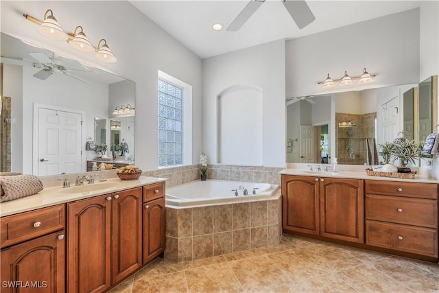 bathroom with vanity, tile patterned flooring, plus walk in shower, and ceiling fan