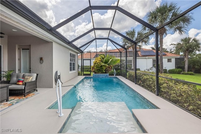 view of pool featuring a lanai and a patio area