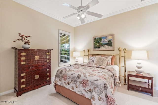 bedroom with ceiling fan, ornamental molding, and light carpet