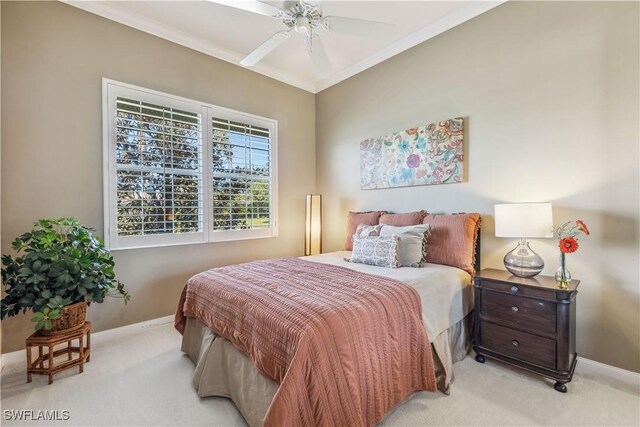 carpeted bedroom with ceiling fan and crown molding