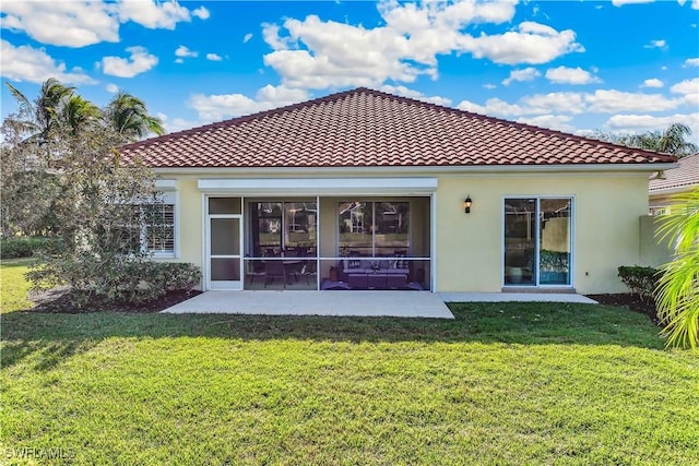 rear view of house with a patio area and a yard