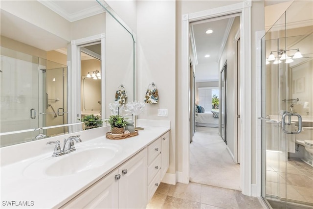 bathroom featuring tile patterned flooring, vanity, an enclosed shower, and crown molding