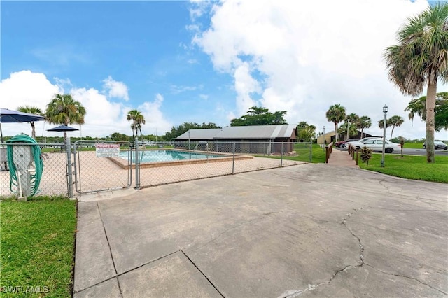 view of pool with a gate and fence