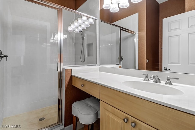 bathroom featuring a stall shower and vanity