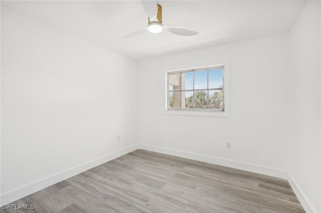 empty room featuring light wood-type flooring and ceiling fan