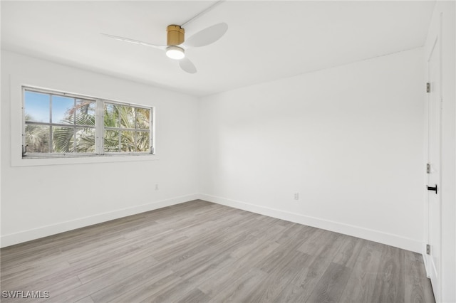 empty room featuring light hardwood / wood-style flooring and ceiling fan