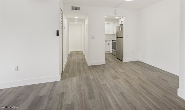 spare room featuring light wood-type flooring