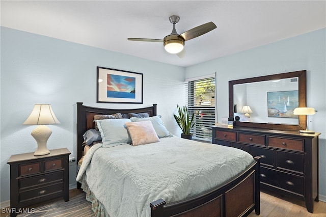 bedroom featuring light wood-type flooring and ceiling fan