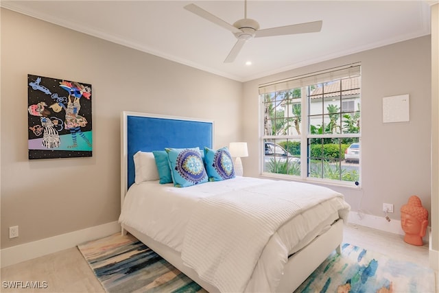 bedroom with ceiling fan and ornamental molding