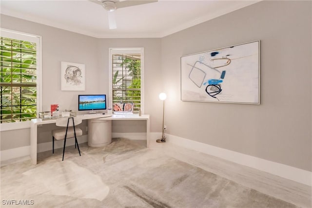 home office featuring baseboards, a ceiling fan, and ornamental molding