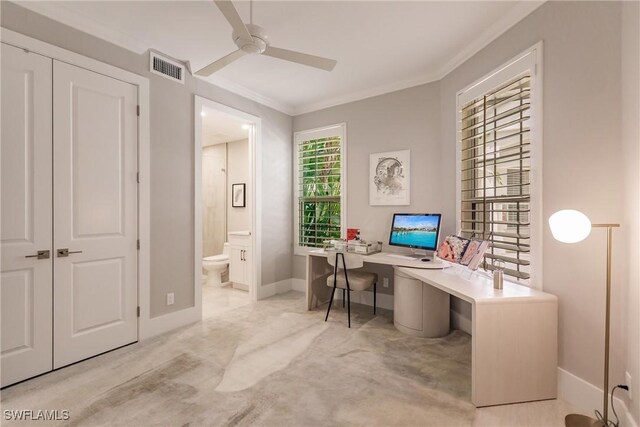 home office with ornamental molding, light carpet, and ceiling fan