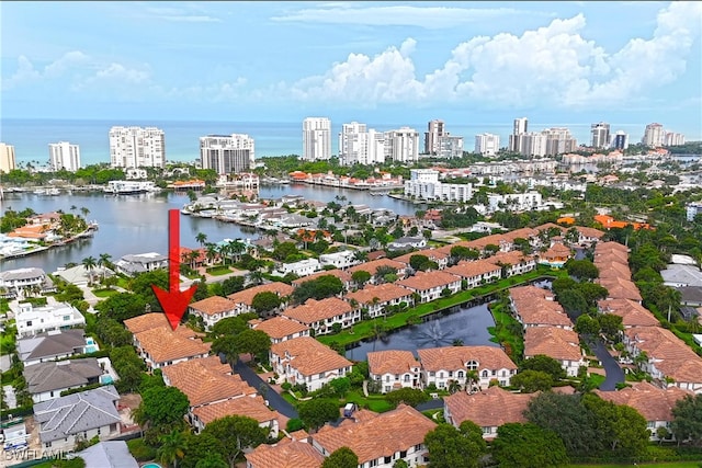 bird's eye view featuring a water view and a city view