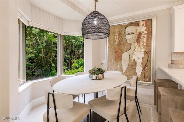 dining area with crown molding