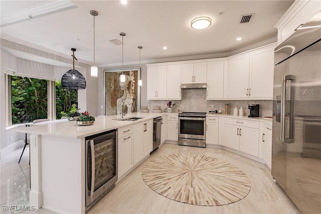 kitchen featuring wine cooler, stainless steel appliances, a peninsula, a sink, and visible vents