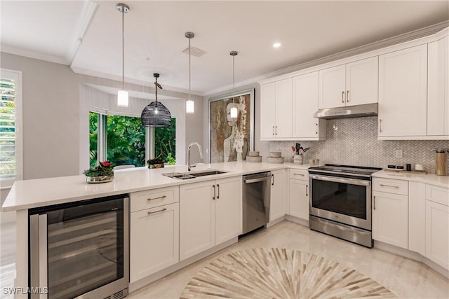 kitchen featuring wine cooler, appliances with stainless steel finishes, a sink, a peninsula, and under cabinet range hood