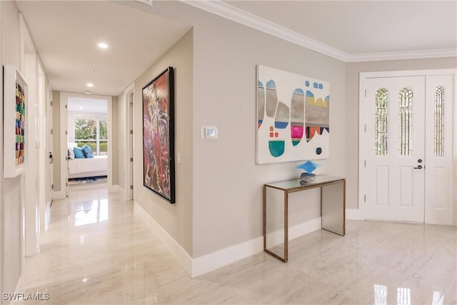 foyer entrance with recessed lighting, marble finish floor, crown molding, and baseboards