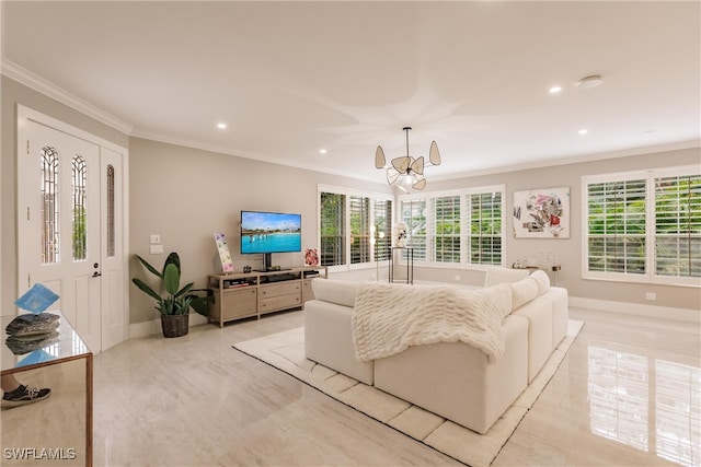 living room with ornamental molding and an inviting chandelier