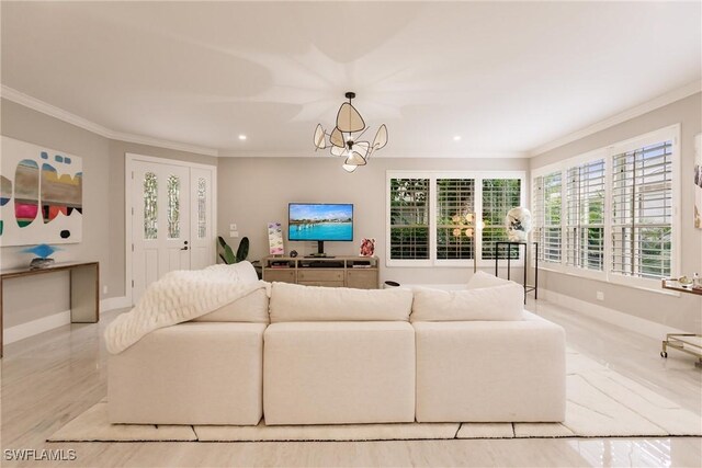 living room featuring light hardwood / wood-style flooring, ornamental molding, and a chandelier