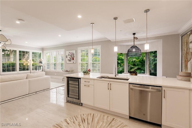 kitchen with beverage cooler, dishwasher, ornamental molding, light countertops, and a sink