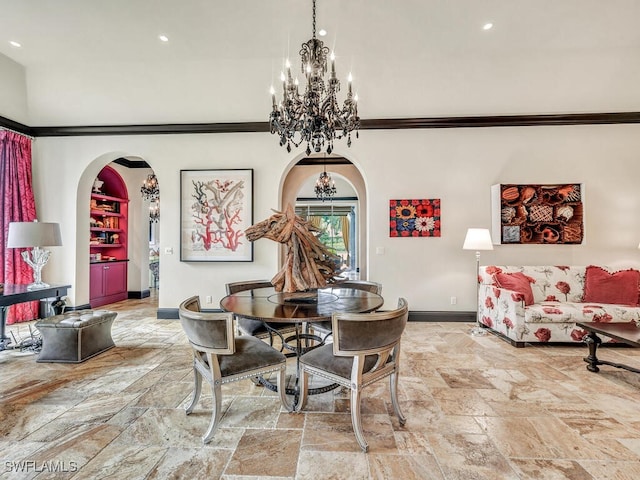 dining space featuring crown molding and a notable chandelier