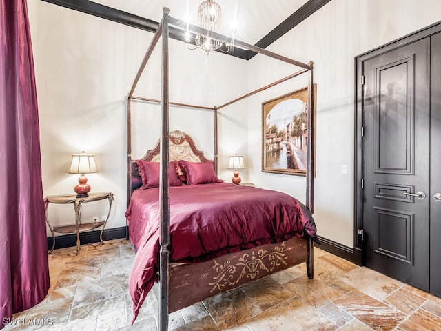 bedroom with an inviting chandelier and crown molding