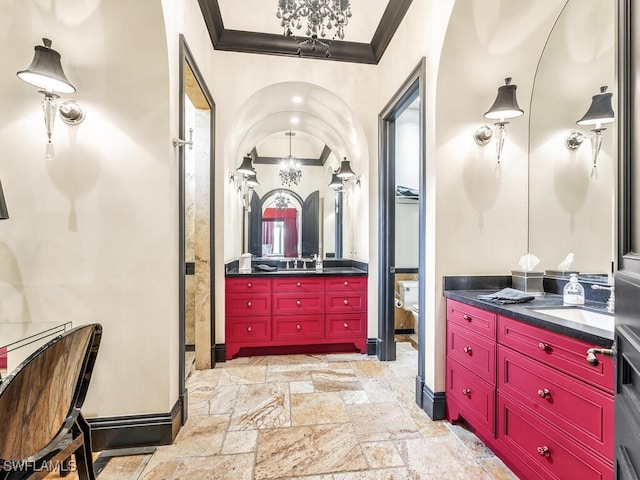 bathroom with crown molding and vanity