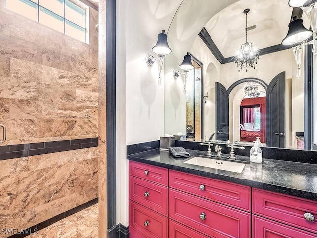 bathroom with an enclosed shower, crown molding, a notable chandelier, and vanity