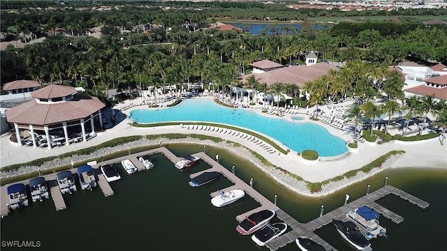 birds eye view of property with a water view