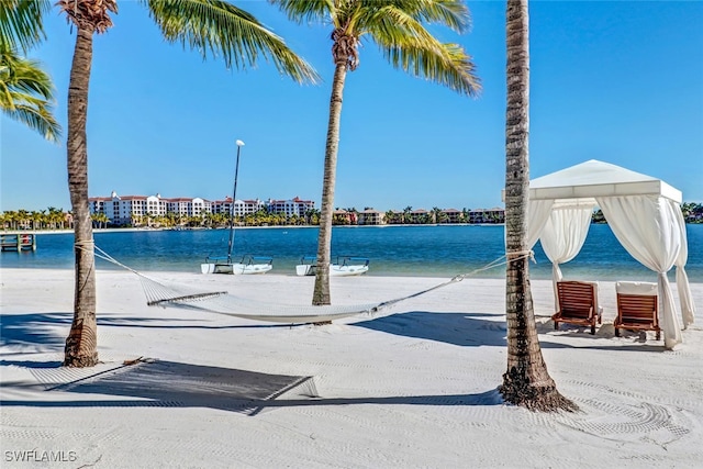 view of swimming pool with a water view