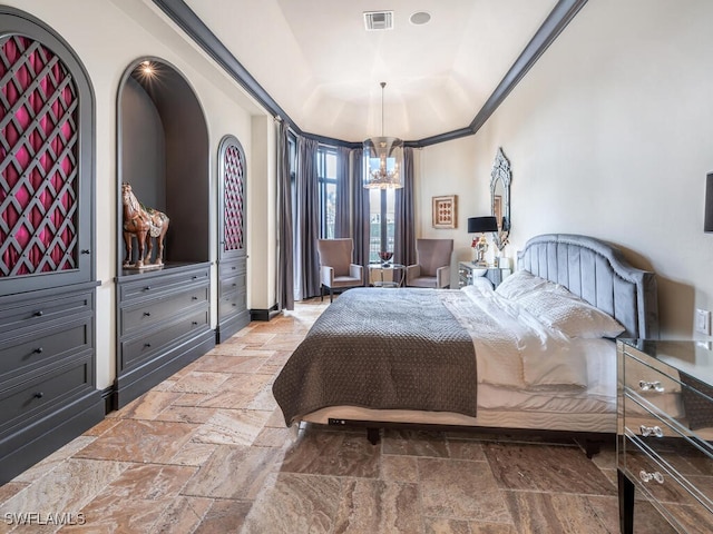 bedroom featuring a raised ceiling, crown molding, and an inviting chandelier