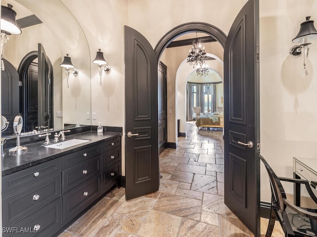 bathroom featuring vanity and an inviting chandelier