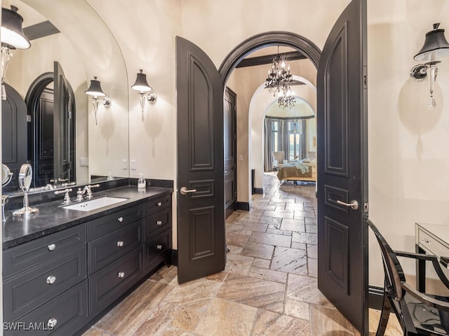 18281 Via Caprini Dr, Miromar Lakes, FL 33913 - bathroom featuring stone tile flooring and vanity
