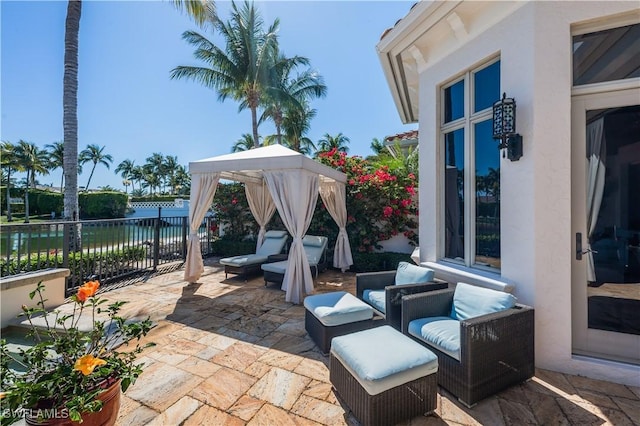18281 Via Caprini Dr, Miromar Lakes, FL 33913 - view of patio / terrace with a gazebo and a water view