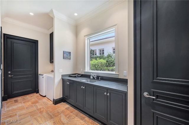 18281 Via Caprini Dr, Miromar Lakes, FL 33913 - bathroom with washing machine and clothes dryer, stone finish floors, crown molding, and vanity
