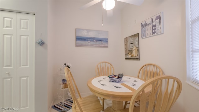 dining area featuring ceiling fan and hardwood / wood-style floors