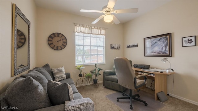office space featuring carpet floors, ceiling fan, and baseboards