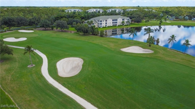 aerial view featuring a water view and view of golf course