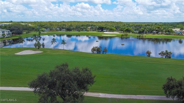view of home's community featuring a yard, a water view, and golf course view