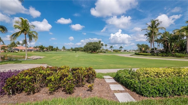 surrounding community with a lawn and golf course view