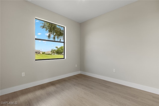 spare room featuring hardwood / wood-style flooring