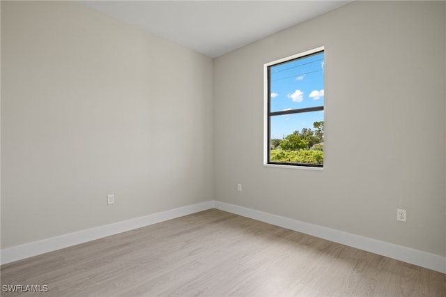 unfurnished room with light hardwood / wood-style floors