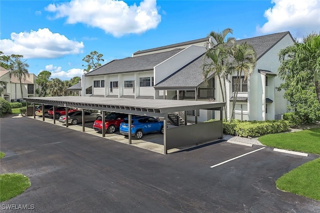 view of partially covered parking lot