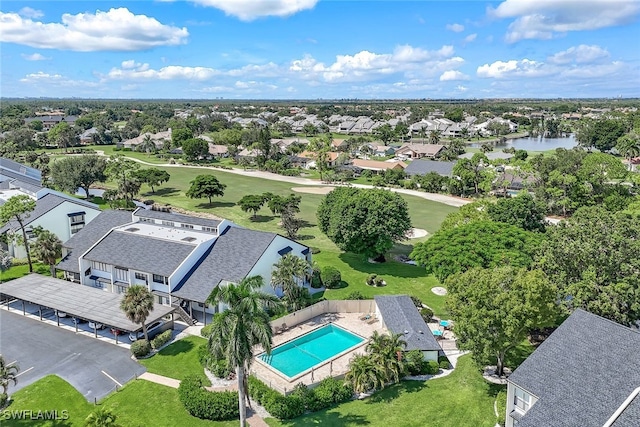 drone / aerial view featuring a water view and a residential view