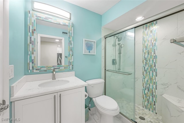 full bath featuring toilet, visible vents, a marble finish shower, and vanity