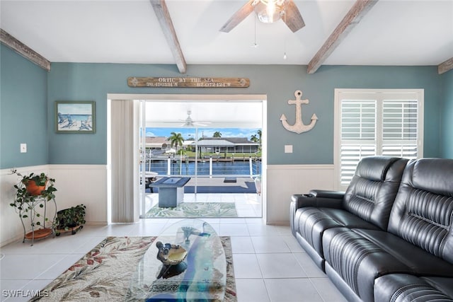 tiled living room featuring ceiling fan and beamed ceiling