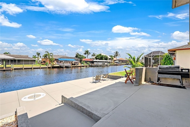 view of dock featuring glass enclosure and a water view