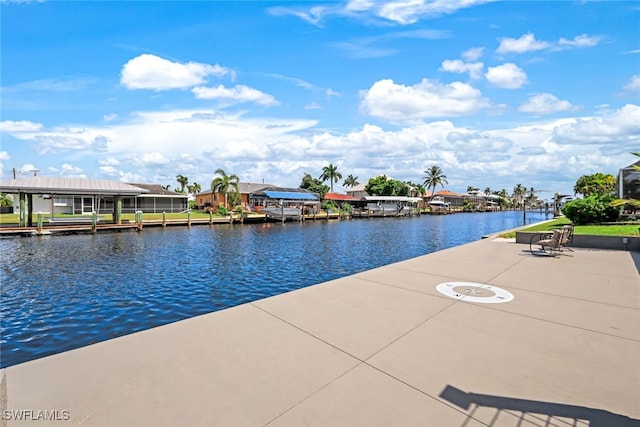 exterior space with a boat dock and a water view